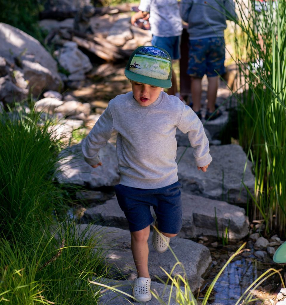 Child on Stepping Stones in Children's Garden at Betty Ford Alpine Gardens
